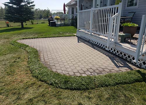 House with white fence and grass.